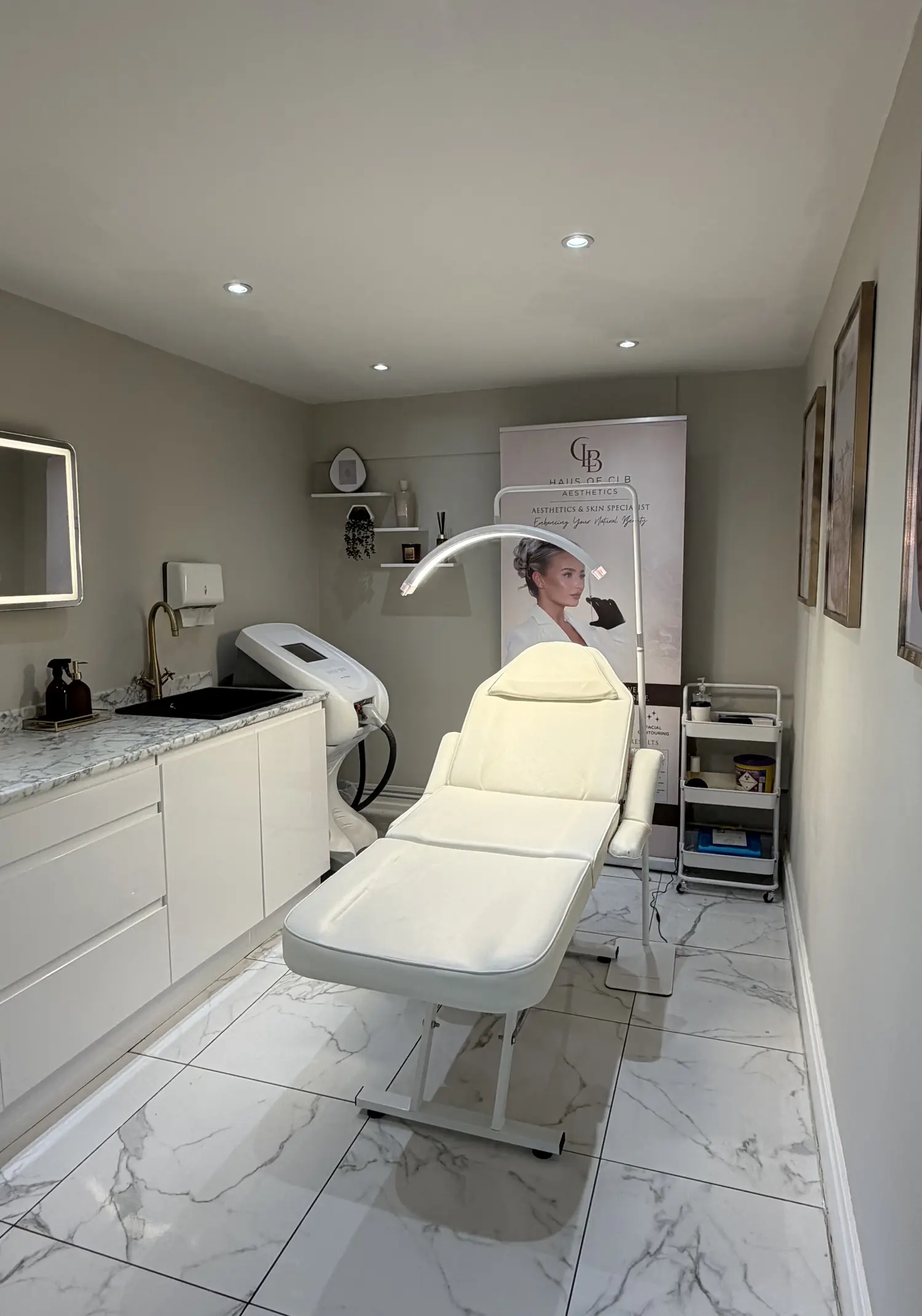 The Haus of CLB treatment room in Prestwich, with marble flooring and clinical lighting